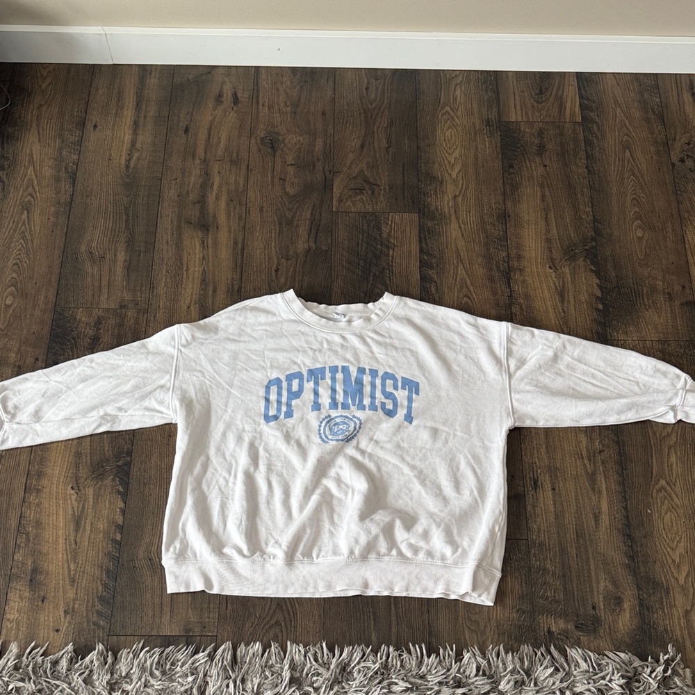 Old Navy White Crewneck Sweatshirt with Light Blue "OPTIMIST" Graphic